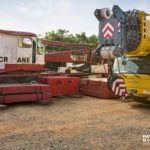 Mobicrane's new Grove 6400 GMK next to their “The Old Lady” a 1966 Manitowoc Vicon 3900T.