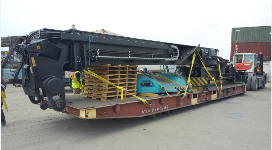 Boom and spreader being delivered ready for commissioning.