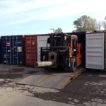 carer electric forklift in a container